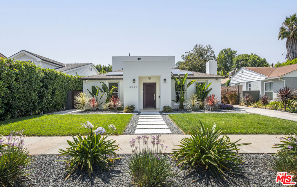 Modern, zen-like retreat in the heart of Sherman Oaks, professionally designed with meticulous attention to detail. This 4BD, 3BA home plus bonus room offers a luxurious primary suite with private balcony, formal dining with fireplace, and a chef's kitchen featuring granite counters, wood cabinetry, stainless steel appliances, and laundry space. The open floor plan flows seamlessly to drought-tolerant landscaped grounds with solar panels, LED lighting, and a sparkling pool, perfect for entertaining. The finished garage offers ADU potential. Located in a top school district, just a short walk to Riverside Drive Elementary and Millikan Middle School.