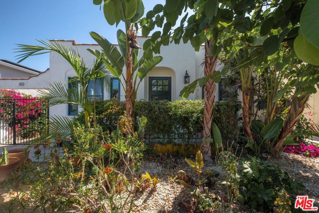 Classic Spanish Bungalow with Smart Updates and Timeless Charm. This 2-bedroom, 1-bath Spanish bungalow blends original charm with thoughtful upgrades that make daily living easy. Inside, you'll find hardwood floors, natural light pouring through brand-new dual-pane windows, and classic architectural touches that give the home real character. The major systems have been taken care of, there's a new roof, new central heat and air, and a tankless water heater for energy-efficient comfort. The layout is clean and functional, with a warm, welcoming feel throughout. Outside, the backyard offers space to unwind or entertain, plus mature fruit trees that add a touch of homegrown goodness. A detached 1-car garage adds convenience and storage options. This is a great spot for anyone who appreciates classic style with modern reliability. Just move in and enjoy.