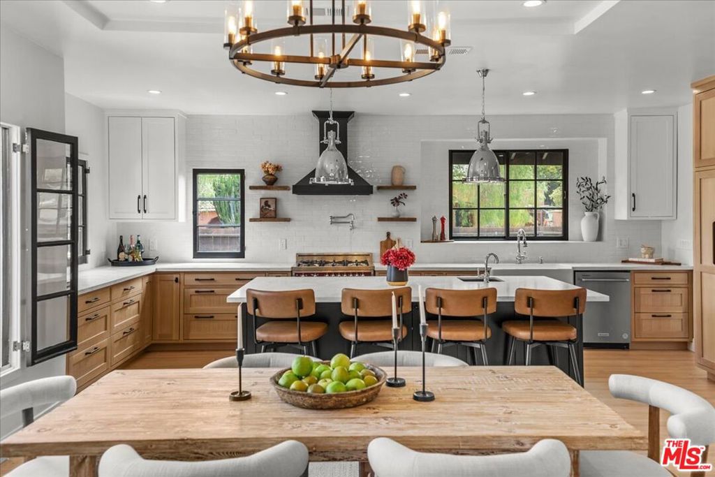 Presenting a rare opportunity to own a beautifully renovated, Spanish Revival home in one of LA's most sought-after and central neighborhoods, Picfair Village. The beautifully reimagined, 3-bed, 3.5-bath main house blends timeless character with modern upgrades, featuring a spacious open floor plan, custom white oak kitchen with inset cabinetry, quartz countertops and high-end appliances. Big living room with high wood beamed ceilings and a huge chef's kitchen with large island and dining area. Super light and bright surrounded by windows, greenery and natural light. Separate laundry room with oversized washer and dryer. And no more sharing bathrooms! each bedroom enjoys it's own ensuite bathroom + there's a half bath for guests so no more worrying about cleaning messy bathrooms before dinner parties! The backyard is an entertainer's dream, with greenery, vibrant bougainvilleas, dragon fruit, a custom diamond-patterned paver/turf patio, lighted landscaping and a fully enclosed privacy fence. Plus both back bedrooms enjoy french doors which contribute to creating a truly remarkable indoor/outdoor experience for events, barbecuing with family and friends, a meditative getaway, private sun-bathing or to just enjoy a glass of wine under the stars after a long day. The property also includes a permitted 1-bed, 1-bath ADU that takes full advantage of being on a corner lot enjoying it's own separate entrance and a dedicated backyard for amazing indoor/outdoor living it's can be kept totally private from the main home, with no shared space! So it's poised to get top dollar as a rental or, as it can also be accessed directly from the backyard as well, you'll have tremendous flexibility to seamlessly make it a great office, guest house or party room for you to enjoy.. Located in the heart of Picfair Village -- a super central neighborhood with a great residential feel. A quiet neighborhood where neighbors walk their dogs. Plus the home is super close to many of LA's most highly desirable destinations minutes from downtown Culver City, The Beverly Grove, West Hollywood and Beverly Hills. And as it's close to the 10 freeway and the Expo Line, it's an easy hop to the beach or DTLA. Super central, connected, and community-oriented... a wonderful place to live.This home provides tremendous space and versatility for anyone wanting a great home and experience an oasis in the middle of the city. Call or Text for Details and Showings.