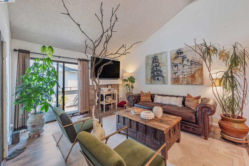 Gorgeous top-floor unit in the highly sought-after Waterford Community of central Newark! This beautifully updated condo offers 2 spacious bedrooms, a versatile office/den, and 2 fully remodeled bathrooms. The modern kitchen features granite countertops, stainless steel appliances and farm sink and recessed lighting. Designer touches include travertine-tiled bathroom, stylish vanities, and newer interior paint throughout. Enjoy soaring vaulted ceilings in the living room, dining area, and primary suite, creating a bright, airy ambiance. Primary bedroom with ensuite bathroom and spacious walk-in closet. Assigned 2 carports. The community boasts resort-style amenities including a gym, tennis courts, pool, and hot tub. Ideally located within walking distance to shops, restaurants, and markets, with easy access to HWY 880—this move-in ready gem is perfect for first-time buyers or anyone seeking comfort and convenience in a vibrant neighborhood.
