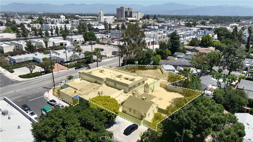 We are pleased to present the opportunity to acquire fee simple interest in 5950 N. Cedros Ave. (et. al. addressees) AKA the “Valley Metro” development site; a 30,735 SF transit-oriented development opportunity. The site is just steps from the intersection of the new East Valley Metro line stop AND the Orange Line at Van Nuys Blvd. and Oxnard St.
In addition to its transit-oriented location, the values appurtenant to the base zoning couldn’t be any more enticing for the permitting and funding of affordable housing. The site’s yield will be dictated by the taste of the developer and their capital constraints and not by zoning policy as virtually all entitlement pathways under CHIP ( DB, MIIP, or AHIP) will allow unlimited density, more FAR than is needed, and likely more height than needed all without a planning case!
It may be a logical use of the site worthy of consideration to develop five stories across the 21,568 rectangular portion and use the current parking lot for parking, trash enclosure, and amenities. By our calculations this could produce, conservatively, about 59,655 SF of leasable area within five stories Type IIIA. Assuming an average unit size of 500 SF, this would produce a yield of about 120 units.