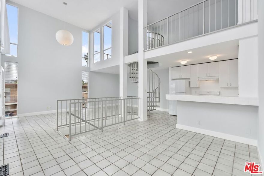 Rare multi-level residence 2 bedroom + 2 bath + loft + roof deck + 2 car private garage just 1 block to the beach.  2-story ceilings in the living room with abundant natural light, an open kitchen, dining space and spacious balconies ideal for indoor/outdoor living.  The loft is a perfect home office, media space or guest area which opens out to the rooftop deck which is a perfect spot to relax. 2 private bedrooms with en-suite bathrooms, each with its own balcony and ample closet space. Private 2 car side by side garage with built in storage cabinets plus a dedicated laundry room. Unbeatable location: minutes to the Venice Canals, Abbott Kinney, Venice Beach, Marina Channel - Top restaurants, cafe's and the beach lifestyle!