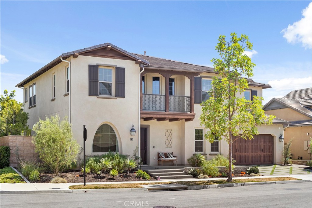 Welcome to 62 Holmes Place, a meticulously upgraded residence in the coveted Greenwood neighborhood of Tustin Legacy. This 4,053 sqft home offers 5 bedrooms and 4.5 bathrooms in a sophisticated open-concept layout designed for modern living. Step inside to discover beautiful wood flooring and recessed lighting throughout, creating a warm ambiance. The main level features a versatile multi-gen suite and a dedicated office, catering to a variety of needs. The expansive great room serves as the heart of the home, featuring multi-panel stacking doors that open to a California room and a spacious backyard - ideal for entertaining. This outdoor oasis, professionally designed by an architect featured on the TV show "Flip or Flop," includes a built-in BBQ and sink, a fire pit with custom sunken seating, and a generous turf area perfect for gatherings. The gourmet kitchen is a chef’s dream, equipped with upgraded cabinets featuring glass uppers, soft-close drawers, and under-cabinet lighting. It also boasts quartz countertops with designer backsplash, a Sub-Zero fridge, top-tier appliances, and Restoration Hardware custom chandeliers, all enhanced by lighting dimmers. A built-in speaker/home theater system and custom-built entertainment center add to the home's modern appeal. Upstairs, you’ll find four generously sized bedrooms, a flexible loft space ideal for a playroom or additional living area, and a well-appointed laundry room for added convenience. The primary suite is a luxurious retreat, complete with a spacious balcony overlooking the serene backyard. The opulent ensuite bath features a massive walk-in shower, a deep soaking tub, dual vanities, and an expansive walk-in closet with ample storage. Accent walls with detailed tile work add a touch of elegance throughout the home. The property also includes a charging outlet for an electric vehicle. Residents of Greenwood enjoy a wealth of amenities, including a park, pool, spa, clubhouse, splash pad, trails, and daily security patrol. Families benefit from guaranteed admission to Legacy Magnet Academy, providing exceptional educational opportunities right in the neighborhood. Centrally located with easy access to the 5 and 405 freeways, and close to shopping and dining destinations such as The District and The Market Place, this home seamlessly blends luxury living with urban convenience.