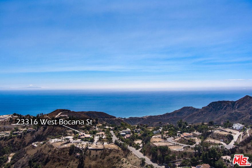 Rare vacant lot in eastern Malibu at Sea View Estates. Perched on a over a third of an acre, with panoramic ocean, mountain & city-light views, this flat buildable corner lot offers privacy and proximity to Santa Monica and the Pacific Palisades. This burn out lot has utilities and services nearby . . . a perfect spot to build your dream home. Prior home had a pool.
