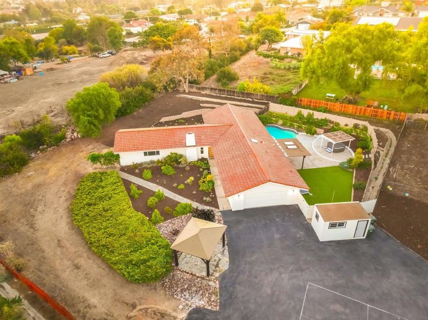 Highly Sought- Fully Remodeled Vista Retreat with Expansive Views. Nestled in the rolling hills of Vista, this private property offers stunning mountain views and nearly an acre of land—perfect for adding an ADU or creating your dream outdoor oasis. Enjoy your own private pool and spa, surrounded by ample space for entertaining and relaxation. The home features a spacious, open-concept layout designed for entertaining, with a seamless indoor/outdoor flow. The kitchen boasts a generous bar area that opens to the outside—ideal for hosting gatherings and serving guests with ease. Two ensuite bedrooms provide comfort and privacy, making this home as functional as it is inviting. Experience the best of Southern California living in this rare and tranquil retreat.