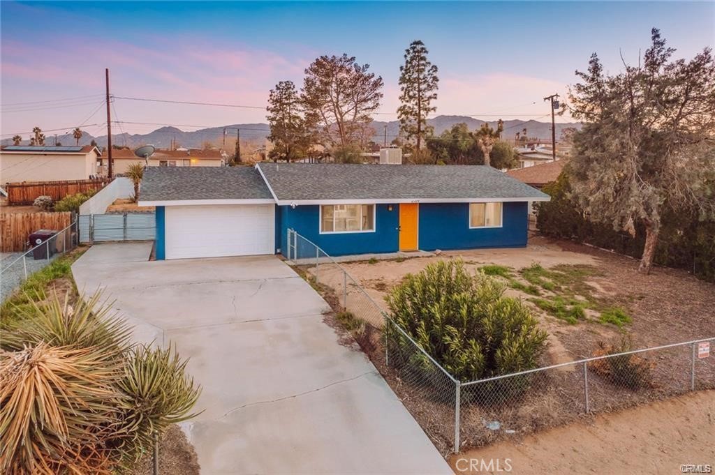 Welcome to 61627 El Cajon a thoughtfully updated 2 bedroom, 1 bath home just minutes from the Joshua Tree National Park entrance. Bright and inviting, the interior features a modern kitchen, cozy living space, and updated finishes throughout. Outside, enjoy a fully fenced yard with a covered patio, above ground pool, and space to relax or entertain. The attached garage offers extra storage or creative potential.