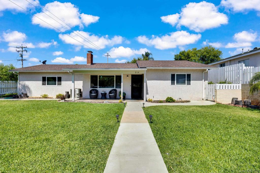 Welcome to this charming single-family home nestled in the heart of Fallbrook, CA. This white picket fenced lined residence offers a cozy yet functional layout, spanning 880 square feet. The home features two bedrooms and a well-appointed bathroom, making it an ideal choice for those seeking comfort and convenience. Step inside to discover a warm and inviting atmosphere, complete with a wood burning fireplace in the living room, perfect for creating lasting memories during cooler evenings. The home is equipped with air conditioning and forced air heating, ensuring year-round comfort. Sitting on a generous sized fully landscaped, corner lot you will feel the pride and joy of being able to call this house your home. The private backyard offers a 15x30-foot covered patio providing an excellent space for entertaining, while the large driveway accommodates multiple vehicles, including RVs and boats. Two extra-large walk-in sheds provide valuable storage or workshop options. Surrounded by pepper trees, this property offers a serene retreat from the hustle and bustle, right in the heart of Fallbrook. Don't miss the opportunity to make this charming home your own.