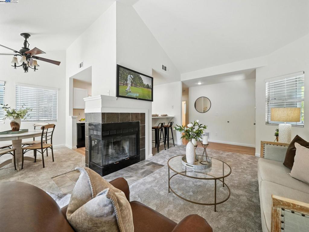 Beautiful, bright, and airy top-floor condo in Pleasanton’s highly sought-after Canyon Meadows community! This inviting 2-bedroom, 2-bath home features vaulted ceilings, fresh interior paint, updated carpet, and a fully remodeled kitchen with quartz countertops, shaker-style cabinets, a new sink, and recessed lighting. The dining area includes a ceiling fan for added comfort. Enjoy two private balconies—one off the living room and one off the spacious primary suite, which also offers a large walk-in closet. The hallway bathroom has been tastefully remodeled, and the unit includes an in-unit washer and dryer for convenience. The guest bedroom features a dual-paned window and a new mirrored closet door. A detached 1-car garage with its own driveway provides secure parking and additional storage. Resort style amenities include 2 sparkling pools, hot tubs, fitness center, tennis courts, basketball and volleyball courts, a clubhouse, and greenbelt—this amenity-rich community also includes water and waste management in the HOA dues, offering a low-maintenance lifestyle with ample recreational opportunities. Located near top-rated Pleasanton schools, shopping centers, dining options, BART, and major freeways (580/680), this home ensures easy commuting and access to everyday essentials.
