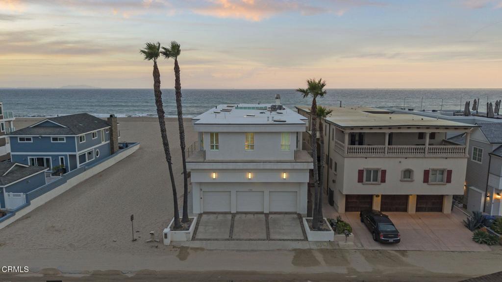 Rare Contemporary Beachfront Jewel on Capri WayA rare opportunity to own one of the most spectacular beachfront homes on the Southern California coast. Perfectly positioned on the semi-private Capri Way, this architectural masterpiece boasts breathtaking ocean, island, and mountain views from nearly every angle. With a unique footprint that extends farther seaward than neighboring homes and an adjacent vacant lot, this property offers unmatched privacy and panoramic northern and southern coastline views.Situated on one of the largest lots in Mandalay Shores, this contemporary estate features custom finishes and design elements that make it a true standout. The chef's kitchen is a culinary dream, adorned with sleek limestone countertops, a large center island, Viking range, Scotsman ice maker, Sub-Zero refrigerator, and freezer drawers--all designed for both function and beauty.The main level includes an inviting great room with expansive ocean views, a media area, full-size custom pool table, brass-top bar, and a 900-bottle walk-in wine cellar. Soaring two-story ceilings greet you at the grand entry, flowing into a formal dining area that overlooks the sea.Upstairs, you'll find four spacious en-suite bedrooms, each featuring its own private view balcony, walk-in closet, and luxurious full bath. Additional amenities include a large open office, state-of-the-art gym, and a six-person sauna.The Master Retreat is a sanctuary unto itself--complete with its own oceanfront balcony, cozy fireplace, generous work space, oversized custom closet, and a spa-like bathroom with sweeping views and premium finishes.Additional features include:Sonos sound system throughoutAutomated blindsLimestone flooringElevatorSecurity systemOutdoor showerFive patios and balconies, each with stunning vistasThree-car garage with new Tesla charging stationIdeally located just north of Malibu and south of Santa Barbara, this home offers the tranquility of a private beach with the luxury and comfort of a modern coastal estate.