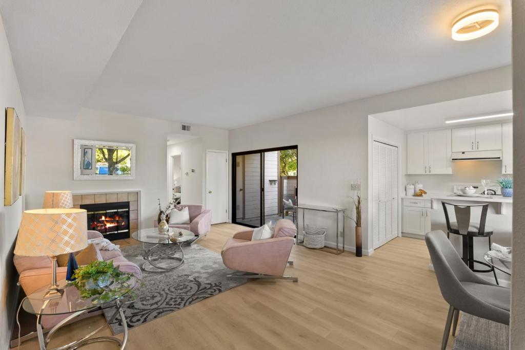 Step into this 2 BD/ 2BA home, where a harmonious blend of comfort, style, and convenience awaits you. The open concept living space is centered around a fireplace that brings warmth and character, while glass sliding doors invite sunlight throughout the day and provide a seamless connection to the private patio. The outdoor space is ideal for relaxing or enjoying the fresh air in a peaceful setting. Adjacent to the living area, the kitchen is arranged for everyday efficiency, featuring modern appliances and ample counter space. The breakfast bar adds a casual dining option while maintaining a natural flow into the dining area, making everyday meals and gatherings effortless. The primary bedroom, situated at the end of the hallway for added privacy, offers generous storage and an ensuite bathroom designed for comfort. The secondary bedroom is versatile, well-suited for guests or a personal retreat, with a nearby full bathroom that enhances practicality. Located in a sought-after area near San Jose Municipal Golf Course, major shopping centers, and the vibrant downtown San Jose, the residence is in a strategic position, balancing accessibility with a sense of retreat.