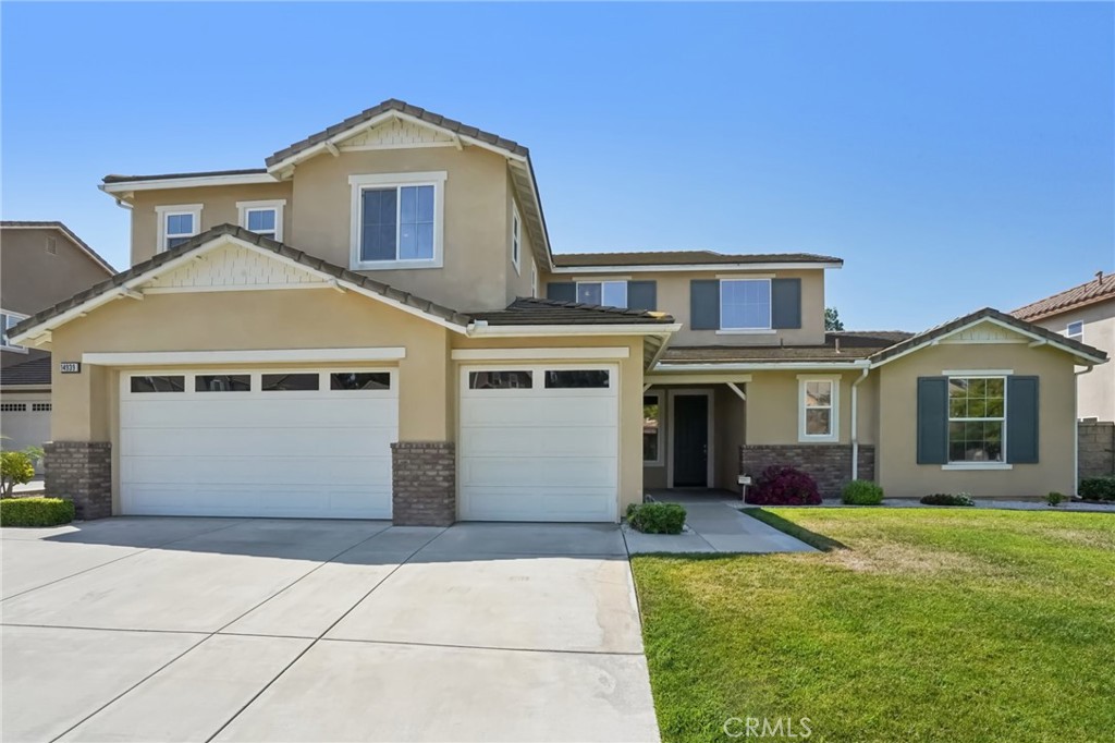 Located on a beautiful tree-lined street in the desirable Avonlea Community, this pristine, spacious and turnkey home offers a thoughtfully designed layout with fresh interior paint and impressive features throughout. You’ll love the great curb appeal and large front yard welcoming you inside.
Off the entry, a formal living room provides a versatile space—perfect for a sitting area, home office, formal dining room, or den—accented by elegant crown molding. Beyond, the expansive family room with gorgeous wood flooring boasts soaring two-story windows, a cozy fireplace, and a built-in media niche, creating an open and inviting atmosphere filled with natural light.
The chef’s kitchen is a true standout with granite countertops, a large center island, built-in cooktop, a double oven, and abundant cabinetry, including glass-front displays and a writing desk area. A spacious walk-in pantry offers exceptional storage, while the adjacent dining area opens to the backyard through sliding glass doors.
Two primary suites—one on each level—provide ultimate flexibility and privacy. The downstairs primary retreat features sliding doors to the backyard, oversized windows, a spa-like bathroom with a 6-ft. jetted soaking tub, dual vanities, a tiled shower, and a His and Hers custom built-in closet system. Upstairs, the second primary suite includes plantation shutters and its own full bath. There are two additional bedrooms and a full bath upstairs with dual sinks. In total, there are six bedrooms, including three downstairs and three upstairs.
Enjoy the convenience of a downstairs laundry room with sink and cabinetry, located off the garage entry. Upstairs, a spacious loft overlooks the entry, adding the perfect spot for a play area, reading nook, or home office.
Step outside to the beautifully manicured backyard, designed for low maintenance with plenty of lush green grass for play and relaxation. Other notable upgrades include a reverse osmosis water system, whole house water softener system, a brand-new A/C unit installed in November 2024 and fully paid-off solar!
This home is clean, well cared for, and truly move-in ready—a perfect blend of comfort, elegance, and functionality for its next lucky owner!