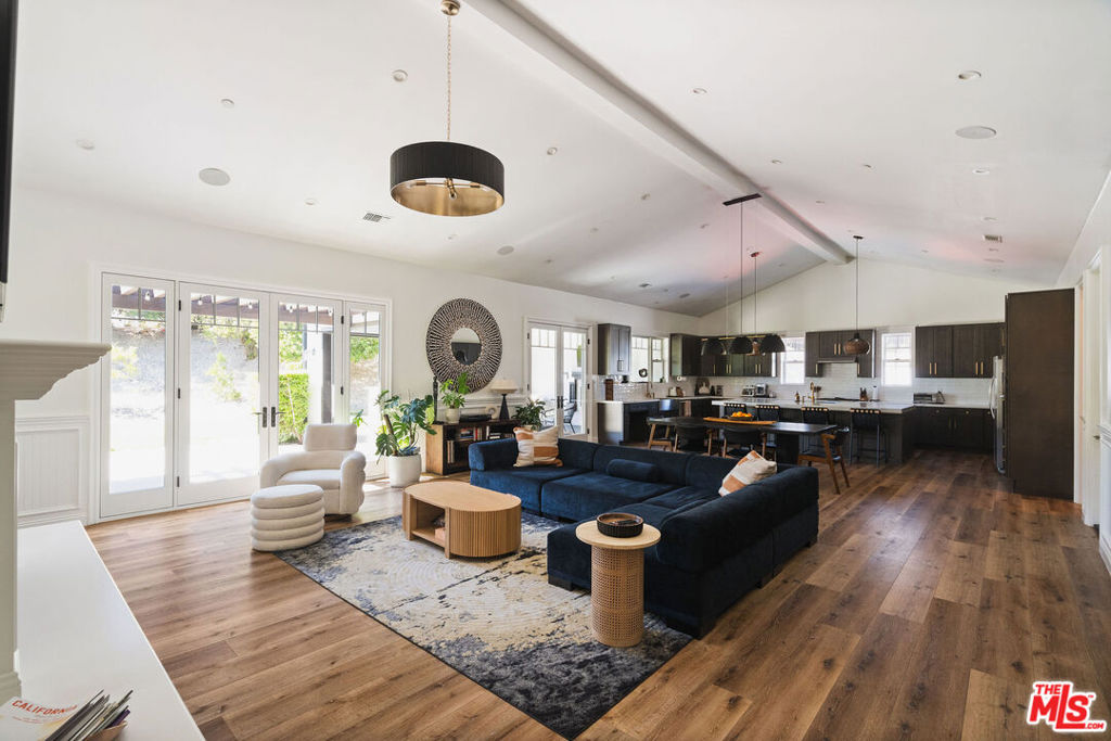 Beautifully remodeled in 2020 and tucked away at the end of a quiet cul-de-sac. This home offers wonderful curb appeal with an updated driveway, oversized garage, and a spacious lot with citrus and apple trees. Inside, a wide entry foyer opens to a large great room and formal dining area. The kitchen features a walk-in pantry and entertainer's island, complemented by craftsman details like crown molding, wainscoting, and high ceilings. A dedicated laundry room provides plenty of storage. The primary suite includes a sitting area, walk-in closet, spa-style bathroom, and private outdoor shower. The backyard is designed for entertaining with a covered patio, BBQ, fireplace, and a sport court with basketball hoop. A timeless, well-maintained home that combines modern updates with character and comfort. Available September 15th, 2025.