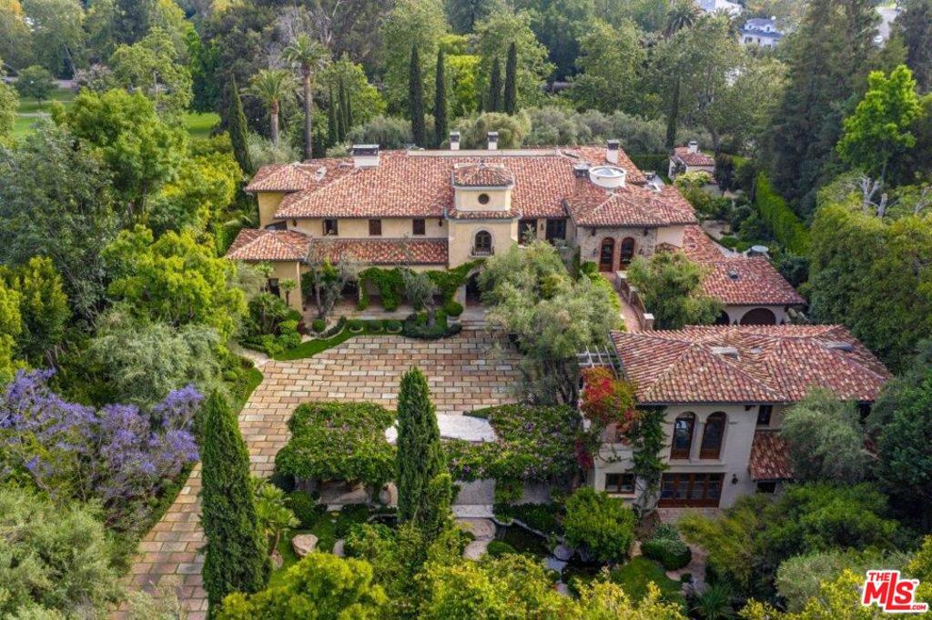 Romantic villa masterpiece conceived by Robert Sinclair & Mark Boone displays unrestrained beauty, craftsmanship & volume. Behind gates, an olive tree lined drive leads to motor court surrounded by trees, koi ponds, pathways & tranquil gardens. 1.3 flat acre compound encompasses 5b, 8ba, 4powders & 2maids in main house & 2-story GH. Dramatic foyer. Grand scale FLR w/ fp. Exquisite library w/ coffered ceiling, fp & office w/ terrace to grounds. FDR enchants w/ wrought iron arched windows/doors. Family room w/ bar & soaring ceiling. Chefs kitchen w/ brick ceiling, island & breakfast rm. Downstairs wine cellar, lounge, bar, screening rm & billiard room. 2nd floor master suite w/ vaulted ceilings, marble fp, 2 terraces, 2ba suites, expansive walk-ins, dressing & sitting rm. 4addtl bd suites upstairs. Undulating bridge to 1bd/2ba GH w/ gym & sauna. Addtl luxurious amenities: ample parking, elevator, pool, spa, outdoor kit & security. The Mapleton Villa awaits its next illustrious owner.
