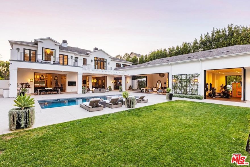 A truly spectacular modern take on a Georgian Traditional estate by architect Philip Vertoch and interior designer Lada Webster. Walk through the dramatic 24 ft high entry to experience an elegantly realized open floor plan that incorporates indoor outdoor living at it's finest. Entertain on a major scale as well as enjoy intimate gatherings with family & friends. No expense spared, features include his study w/custom cabinetry and double doors to the front of the estate, impressive chef's kitchen with La Cornue range and hood that flows into an extensive family room, and speakeasy inspired music lounge w/floor to ceiling wine storage & chiseled limestone fireplace wall. An extraordinary primary suite w/balcony overlooking the back of the estate, including the lighted tennis court, sparkling pool, and expansive grounds. Proper homeschool classroom. Pool house Cabana w/gym, 8+ car subterranean garage. 7 beds, 10 baths. Photos do not capture scale or true beauty this estate is a must see