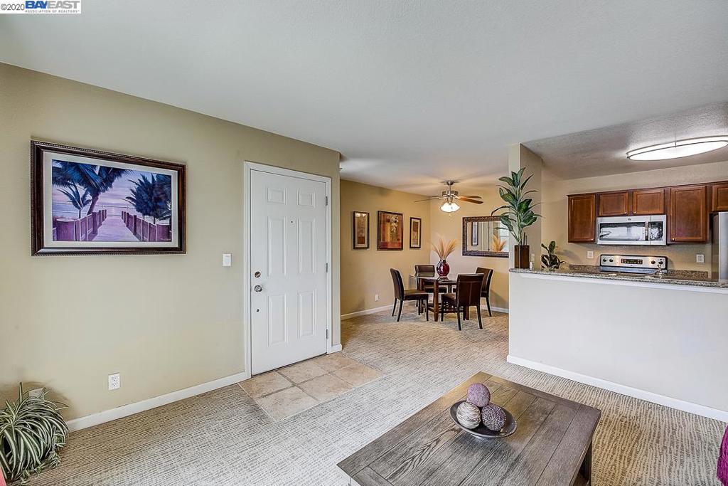 Beautiful second floor condo in a peaceful community. Kitchen features new stainless steel refrigerator, dishwasher, and microwave, granite countertops, stone floors, stainless steel double sinks, and cherry wood cabinets. Newer dual pane windows and sliding door. Upgraded carpet.New Air Vents in both bathrooms. Both bathrooms have granite countertops, stone floors and cherry wood cabinets. Walk-in closets in both bedrooms. New patio/balcony and outside storage door. One assigned parking and ample visitor parking. New exterior paint and landscaping for condo complex. Upgraded clubhouse. Community amenities include access to resident clubhouse, luxurious pool, hot tub, fitness center, playground. HOA fees include water and trash. Three on-site and convenient laundry facilities. Top-rated schools: Oliveira Elementary, Thornton Jr. High, American High School. Conveniently located to 880/680/84, parks, lakes, shopping and trains/BART. Great for families and commuters!