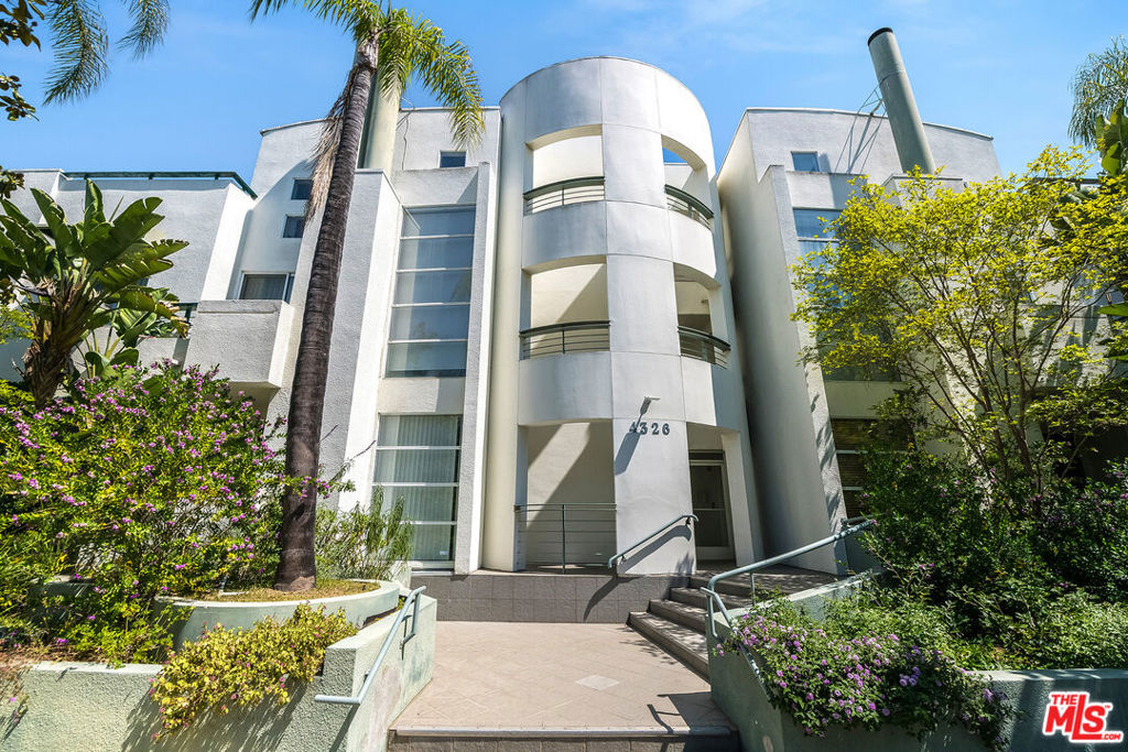 Welcome to this stunning top-floor penthouse in the heart of Studio City! Huge roof top private deck with views!!! 2 bedroom , 2 bathroom plus loft!! No shared walls!! This light-filled corner unit features soaring 20'+ ceilings, hardwood floors, a gas fireplace, and a brand-new sliding glass door that floods the space with sunshine. The recently remodeled chef's kitchen is a show stopper complete with custom soft-close cabinetry, quartz countertops, high-end stainless steel appliances, recessed and under-cabinet lighting, and abundant storage. Both bedrooms are spacious and serene, with peaceful neighborhood views. The primary suite boasts its own fireplace, ample closet space, and a luxurious new bathroom featuring quartz countertops, a double vanity, stylish stone flooring, and a spa-like shower with a built-in bench and custom glass enclosure convertible to a steam shower! A spacious loft on the second floor offers flexible use as an office, gym, or playroom and leads directly to the home's crown jewel: an approx. 500 sq. ft. private rooftop deck. Perfect for entertaining or relaxing year-round, it offers incredible views and unmatched outdoor living. Additional features include: 500+/-sqft roof top deck, new HVAC with Nest thermostat, 2 fireplaces, in-unit laundry, automatic window treatments, no shared walls, remodeled unit, two designated parking spots, extra storage, and guest parking. The building also offers a charming courtyard and HOA dues that include earthquake insurance. Located in the coveted Dixie Canyon Charter School district and close proximity to Ventura Blvd hotspots like Erewhon, Trader Joe's, Equinox, Beeman Park, Sugarfish, Casa Vega, Granville, and so much more!