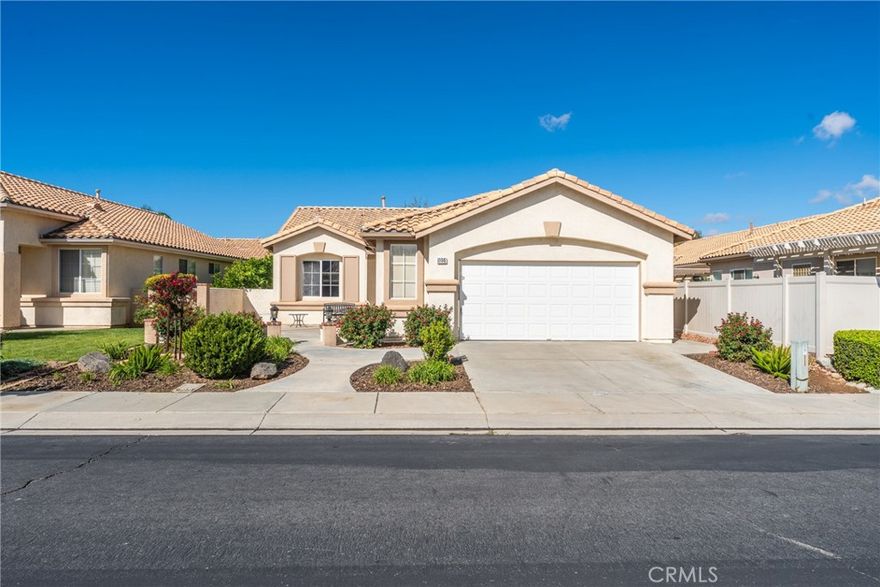 Welcome to 1851 Riviera Ave, a beautifully maintained single-story home in the highly sought-after Sun Lakes Country Club. This 2-bedroom, 2-bath home offers over 1,500 sq. ft. of bright, open living space with tasteful updates throughout. The kitchen features stainless steel appliances, while the family room includes a cozy fireplace for added charm and functionality. Enjoy two patios; one in front for your morning coffee and a covered patio in back with a hot tub for relaxing or entertaining. The home also includes vinyl fencing, a 2 car garage with built-in cabinets, and plenty of storage. Located in a resort-style 55+ community with an amazing golf course, pools, tennis courts, and more, this move-in-ready gem combines comfort, convenience, and an unbeatable lifestyle.