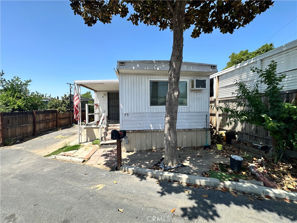 Just Listed in Riverside – Affordable & Convenient Living! Welcome to this charming and well-maintained mobile home located in the quiet and friendly Palm Terrace Mobile Village. This cozy home features 2 spacious bedrooms and 1.5 bathrooms, perfect for comfortable everyday living. You'll love the open floor plan, dual-paned windows, window AC units, and a convenient indoor laundry area. Bonus: A large carport that fits up to 4 cars – perfect for multi-car households or extra storage needs! Prime Location – Just minutes from: Costco & Walmart, Freeway 91, Lake Mathews, Kaiser Permanente Medical Center, and so much more! This home is a great opportunity to own in a peaceful community close to everything Riverside has to offer. Let’s schedule your private tour today!