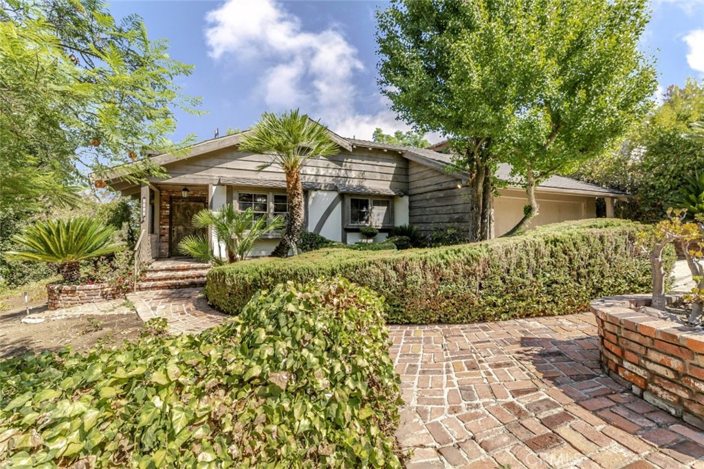 Welcome to 3853 Eureka Drive, a beautifully crafted 4-bedroom, 2-bathroom home nestled in the heart of highly sought-after Studio City. Boasting 2,323 sq ft of living space across two spacious stories, this warm and inviting residence blends classic California charm with thoughtful architectural details.
Inside you'll discover exposed beamed ceilings, a cozy fireplace, and rich wood accents that create a sense of warmth and character throughout the home. The living and dining areas offer an ideal layout for both relaxing and entertaining, while the abundance of natural light enhances the home's inviting ambiance.
Upstairs, generously sized bedrooms offer privacy and comfort, perfect for families or those needing flexible space for a home office or guest rooms. The 2-car garage provides convenient parking and additional storage.
Outside, enjoy the peaceful residential vibe of Eureka Drive, just minutes from top-rated schools, local dining, boutiques, and the vibrant culture of Ventura Blvd.
Whether you're looking to move right in or personalize to your taste, this rare Studio City gem is full of potential and timeless appeal.