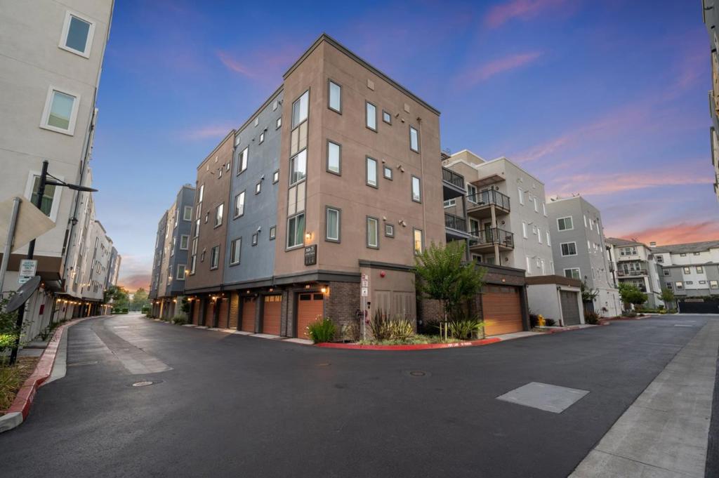 Welcome to 1452 Nightshade Rd #40, situated in the highly desirable Metro Community of Milpitas. This stunning 1,220 square foot top floor penthouse suite features 1 bedroom, 2 full bathrooms, and a fantastic multipurpose loft that can be used as a second bedroom, flex office, or additional entertaining space. Enjoy the open concept layout with soaring high ceilings, abundant natural light, and a spacious living/ dining area. The modern kitchen boasts quartz countertops, stainless steel appliances, and a large island, which is ideal for everyday living and entertaining friends/ family. Retreat to the spacious primary bedroom with tons of natural light. Additional highlights include expansive views from your private balcony, custom shutters, in-unit laundry, central A/C, and secure parking space inside your 1 car garage that has direct access into the building. This property is truly a phenomenal find as it has never been lived in full time and is in immaculate, like new condition. Prime location of the Silicon Valley with close proximity to the Great Mall, BART, VTA Light Rail, Highways 680/237/880, Bob McGuire Park, tennis courts, playground, shopping, restaurants, top rated local schools, and high tech companies. This is luxury living at its best, do not miss this one!