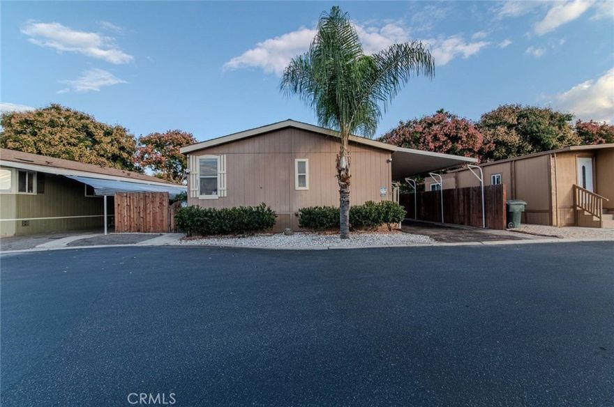 Charming 4-bedroom, 2-bath mobile home featuring a cozy fireplace and a spacious layout. Located in a friendly community with great amenities, including a pool, spa, gym, and playground. Just minutes from Mount Rubidoux, offering beautiful views and popular hiking trails. A perfect blend of comfort, convenience, and outdoor living.