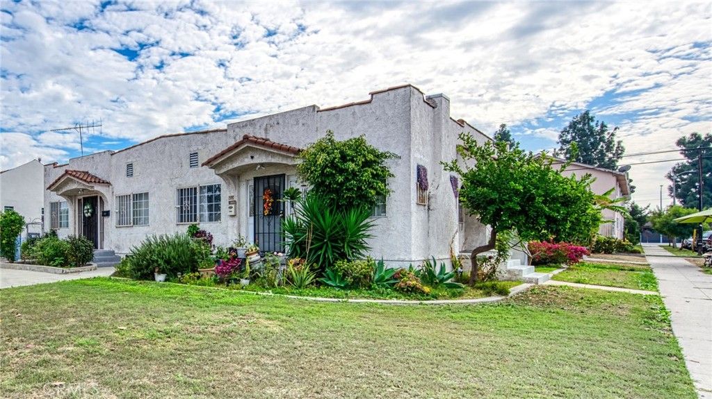 Photo of 3982 S Gramercy Pl, Los Angeles, CA 90062 (MLS # PW25259008)