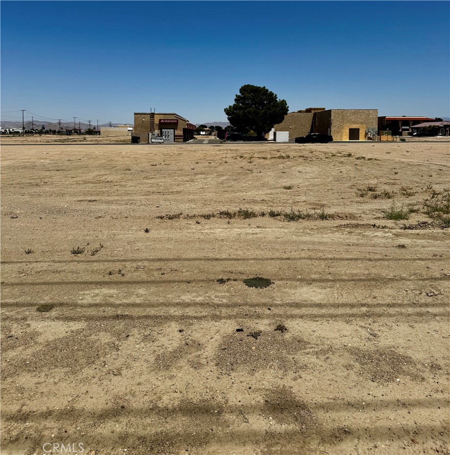 Prime Commercial Land in the Heart of Victorville – 1 Armagosa Road
Located in the vibrant center of Victorville, this highly visible commercial parcel sits directly beside the Victorville Courthouse and across from the Police Station—offering unmatched exposure and convenience. Positioned in a thriving area with consistent traffic, this property presents an excellent opportunity for developers or entrepreneurs looking to establish a presence in one of the city’s most strategic locations.
Zoned CC-1 (Community Commercial), the property allows for a broad array of permitted and conditionally permitted uses as of July 22, 2025. From professional offices and service-based businesses to retail, dining, and entertainment establishments, the possibilities are vast. Permitted uses include barbershops, salons, repair shops, financial institutions, bakeries, cafés, grocery stores, restaurants, medical offices, and more.
The zoning also supports sustainable features, such as rooftop gardens, solar panels, bicycle racks, vehicle charging stations, and even wind turbines (subject to conditions). Temporary uses are allowed with appropriate permits and include events such as farmers markets, parking lot sales, special event sales, and seasonal uses like pumpkin or Christmas tree lots.
Ideal for public, nonprofit, and community-oriented developments, the site also accommodates uses like libraries, museums, parks, churches, convention centers, and educational or training facilities. Whether you're planning a commercial venture, community resource, or mixed-use development, this land offers the flexibility and location to bring your vision to life.
Don't miss this rare chance to invest in one of Victorville’s most central and adaptable commercial lots. Contact us today to learn more about zoning specifics and how this property can support your development goals.