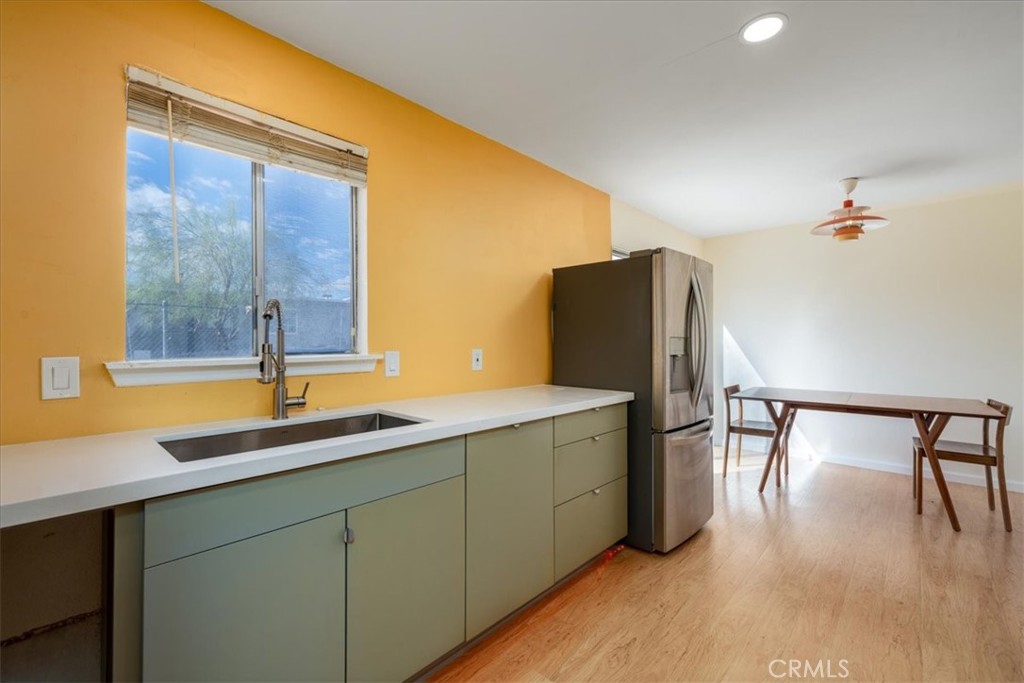 Discover this beautifully updated single-family home in the desirable Chocolate Drop neighborhood of 29 Palms. Thoughtfully reimagined with a mid-century modern aesthetic, this home combines timeless design with fresh, contemporary upgrades. Ideally located near schools, the library, the farmer’s market, hip downtown shops and dining, and just minutes from the East Entrance to Joshua Tree National Park, it offers both style and convenience. Inside, you’ll find brand-new wood grain luxury vinyl plank flooring throughout, paired with stylish new light fixtures that complement the home’s modern design. The fully remodeled kitchen showcases custom cabinetry, quartz countertops, a new sink, LED under-cabinet lighting, USB outlets, and stainless steel appliances including a smart gas range with matching hood. The space is also dishwasher ready for added functionality. The bathroom has been completely redone with all-new plumbing, sink, tile, flooring, shower, and toilet—every detail thoughtfully upgraded. Mitsubishi mini-splits with a single condenser efficiently cool and heat the entire home, but there is also a swamp cooler and gas wall heater for additional efficiency. Offered furnished, this move-in-ready property is a versatile opportunity: an ideal affordable primary home, a desert retreat near Joshua Tree, or a strong long-term rental investment in a growing market. With style, comfort, and functionality already in place, this home is ready to welcome its next chapter.