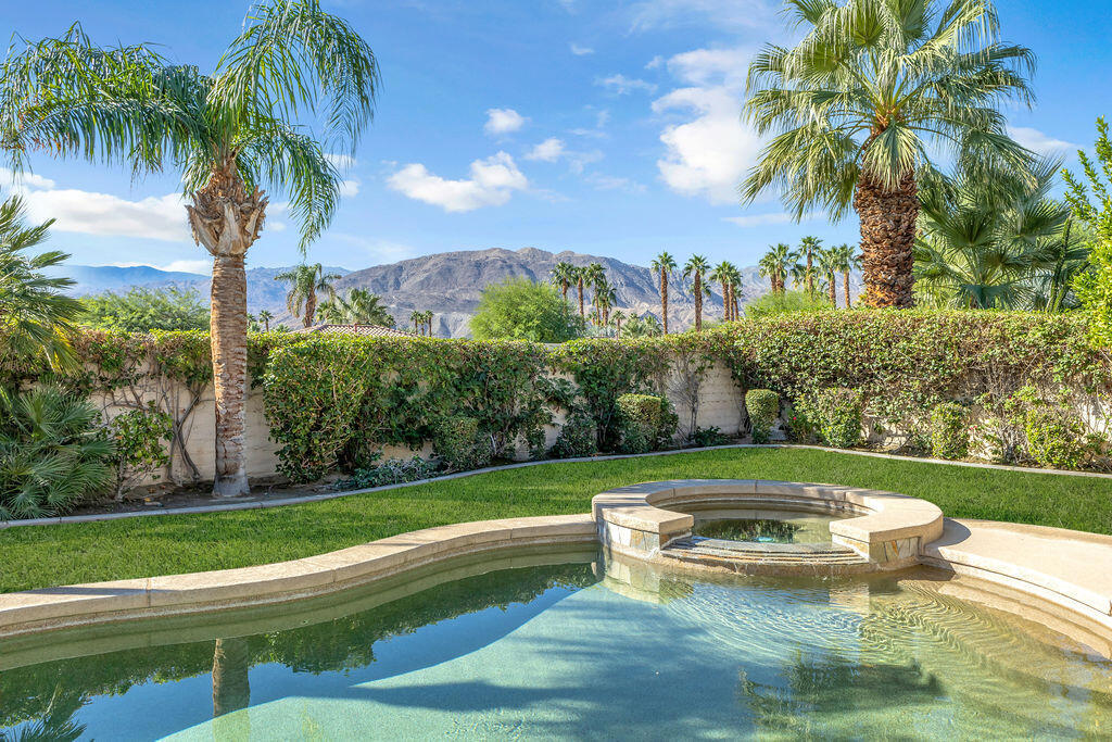 There's a certain kind of calm that settles over La Terraza in the evening--when the sun slips behind the mountains and the sky turns a shade of gold that only exists in Rancho Mirage. At 29 Calle La Reina, that calm feels like home.Behind its gated entry and double doors, light pours through generous windows, illuminating open, graceful spaces that flow effortlessly from one to the next. The great room, framed by a corner fireplace, invites connection--whether for quiet mornings or lively dinners that linger into the night.The kitchen and dining area balance warmth and refinement, where soft tones, thoughtful finishes, and an easy rhythm create a space that feels both lived-in and luxurious. Every corner reflects an ease that can't be designed--it's simply felt.Four serene bedrooms and three baths include a stylish detached casita with its own entrance, while the primary suite offers a sanctuary of light and tranquility with a sitting area, backyard access, and a bath complete with dual vanities, walk-in shower, and soaking tub for slow, unhurried moments.Beyond the glass doors, the desert's quiet beauty unfolds--mountain silhouettes, the still shimmer of a pebble-finished pool, and lush landscaping that frames the scene in vibrant color. The coated concrete patio extends beneath retractable awnings, creating a private haven where afternoons stretch easily into starlit evenings.Thoughtfully equipped with solar power, the home blends sustainability with effortless comfort--reducing costs while honoring the desert sun that gives this place its magic. Sold furnished, it's more than a residence; it's an invitation to live gracefully, surrounded by the timeless allure of Rancho Mirage, with world-class dining, golf, and the cultural legacy of Sunnylands just moments away.