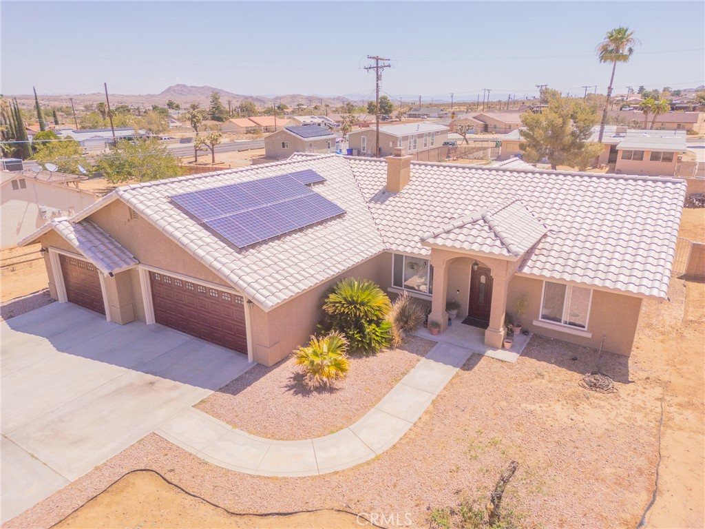 DESERT BEAUTY!!! Come and see this amazing 3-bedroom 2 bath home with the most spectacular views of the Mesa. Step into the large living room with a cozy fireplace, perfect for those chilly desert nights. The kitchen offers granite countertops with newer stainless-steel appliances. Off the kitchen is a nice sized dining area. The primary suite is very spacious, with a beautiful bathroom complete with a custom walk-in shower, gorgeous light fixtures and walk in closet. Next you will find an oversized laundry room with a sink with plenty of storage. You will have ample room for your vehicles and anything else you might need to store in the 3-car garage. Some of the extras that make this the perfect home are solar panels, water softener, newer exterior paint, hot water heater and HVAC, and a gated RV parking area.