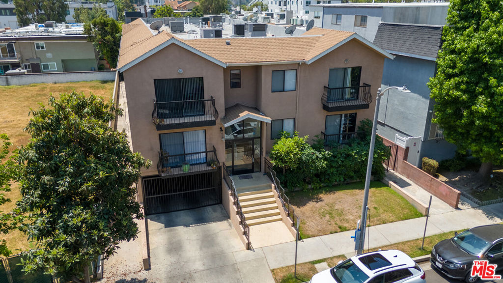 Nestled in a charming 7-unit complex just moments from the energy of the NoHo Arts District, this bright and spacious townhome-style condo offers over 1,400 square feet of comfortable living across two well-designed levels. Actual: 2 bedrooms, 2.5 baths, loft converted to a guest room. As a front-facing end unit, it enjoys abundant natural light and scenic views from two private balconies. The main level welcomes you with an open-concept living and dining area that connects to a recently remodeled kitchen perfect for both everyday living and entertaining. Upstairs, you'll find two generously sized ensuite bedrooms and a flexible third room, converted from a loft with added drywall and a door ideal as a guest space, office, or creative retreat. The primary suite features a large walk-in closet and its own private balcony overlooking the neighborhood. Additional highlights include in-unit laundry, recessed lighting, central air, and two tandem parking spaces in a gated community garage. With a low HOA that covers essential services like water, sewer, trash, and exterior maintenance, this is low-maintenance living in one of LA's most connected neighborhoods just minutes from Toluca Lake, Burbank Studios, and major freeways.