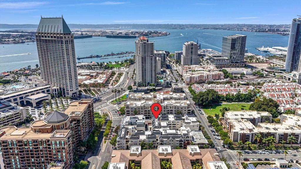 Excellent! Investment opportunity: Do not miss this beautifully updated one-bedroom, one-bath Corner unit in Downtown San Diego's Marina District. This unit is bright and sunny. Imagine yourself enjoying breakfast or a wonderful dinner on the balcony overlooking the beautiful San Diego scenery. The property has hardwood floors, shutters, and an upgraded bathroom. The kitchen is equipped with stainless steel appliances and wood cabinets, perfect for cooking and entertaining. The seller just installed a new HVAC System. It has a dedicated secure parking space in a private garage. The HOA allows 1-month rentals, making it an incredible opportunity.