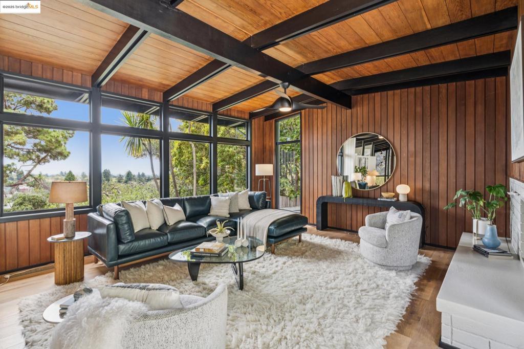 Beautiful bay and hill views from nearly every room, iconic design + serene privacy come together in this dramatic mid-century modern oasis designed by renowned architect Carlton Arthur Steiner. Set on an oversized, private lot across from Great Stone Face Park, this stunning residence seamlessly blends timeless architecture with the ease of modern living. Walls of glass open to a lush front patio, infusing the open kitchen, living, and dining areas with natural light + tranquil views of gorgeous mature landscaping w. signature granite outcroppings. Vaulted ceilings + clean, light-filled aesthetic elevate every moment - whether entertaining or unwinding. Meticulously maintained, it features gleaming hw floors, stylishly baths + remodeled gourmet kitch w Viking appliances. Oversized Zen-inspired back yard lodge - perfect for creative pursuits, quiet retreats, or unforgettable gatherings. Ample storage + sunny 2-car garage w endless potential. Unbeatable location near Indian Rock, Kensington Circle, Solano Ave. + top commuter routes, this extraordinary property is a private sanctuary! Views: Downtown