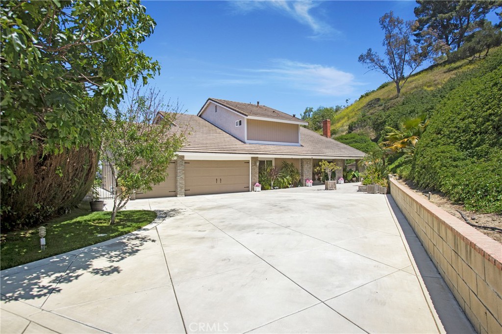 Stunning View Home with Outdoor Kitchen, Privacy & Spacious Living
This immaculate, fully updated 4-bedroom, plus large office 3-bath home sits on a 3/4-acre private lot with sweeping, unobstructed views. Perfect for entertaining, the backyard features an impressive outdoor kitchen, an outdoor jacuzzi perfectly positioned to enjoy the amazing view, and generous patio space. In the front yard, the driveway is lined with a variety of beautiful, mature fruit trees.
Inside, you’ll find a huge family room with a stunning fireplace, a beautifully updated kitchen, and a convenient downstairs bedroom with a full bath.
Upstairs, the primary suite is a true retreat with a spa-like bathroom featuring an oversized Jacuzzi tub, dual vanities, and a separate shower. Just off the primary suite is an expansive office with the most incredible view.
Located minutes from three major freeways, just 10 miles from Downtown Los Angeles, and bordering both Orange County and the San Gabriel Valley, this home offers an unbeatable combination of privacy, convenience, and accessibility.
With storage galore, modern upgrades throughout, and outdoor living spaces designed for both relaxation and entertaining, this property is the perfect blend of comfort, elegance, and functionality—your own private sanctuary with easy access to everything Southern California has to offer.