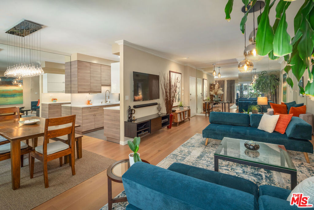 Welcome to this beautifully renovated front-facing, single level 2-bedroom, 2-bath luxury condominium, offering the ultimate in sophisticated urban living. Spanning 1,169 square feet, this sophisticated home has been stylishly updated with superior finishes and a sleek contemporary, yet timeless design. The open-concept living and dining areas feature wide-plank hardwood flooring, refined crown molding, foliated sight lines and abundant natural light. The tastefully designed, modern kitchen features stone countertops, stainless steel appliances, and ample cabinetry ideal for entertaining and everyday living. The generously sized bedrooms include custom closets, built-ins and updated bathrooms with designer fixtures and finishes. A Juliet balcony, in-unit laundry and smart technology add to the comfort and convenience of this extraordinary turn-key home. It is an immaculate and pristine residence in an impeccably managed building. Additionally, there is plentiful public parking at the end of the street. Artfully renovated in 2019, 1250 North Kings stands out as a premier, professionally landscaped property on one of the best blocks in West Hollywood. Ideally located within easy reach of world-renowned restaurants, retail and entertainment, this is urban living at its finest! Amenities for this well-managed building include a Butterfly Intercom System, sparkling pool, sauna, fully equipped state-of-the-art gym, secured parking and additional storage, all at a low HOA of just $530 including EQ insurance. Furnishings available for separate purchase.