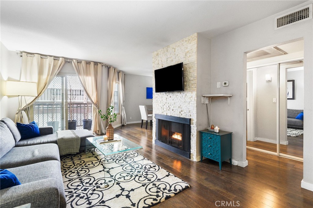 Welcome to The Rob Clark – Where Sophistication Meets Style in the Heart of West Hollywood. This impeccably curated 1BD/1BA with den condo presents a rare opportunity to own a chic, turnkey residence in one of Los Angeles’ most coveted locations—at the intersection of 3rd and Clark, just steps from Beverly Hills, The Ivy, Cedars-Sinai, and Robertson’s world-renowned boutiques and restaurants. Designed for the discerning buyer, the open-concept layout is ideal for both effortless entertaining and relaxing in style, featuring stunning hickory or light oak hardwood floors, a cozy fireplace, and a private balcony. The gourmet kitchen is a chef’s delight with Caesar stone countertops, sleek stainless steel appliances, and a breakfast bar that seamlessly connects to the dining and living areas. A modern in-unit washer/dryer offer convenience and comfort. The tranquil bedroom suite includes a generous walk-in closet—perfect for the fashion lover—while the versatile den is ideal as a home office, guest nook, or creative space. Enjoy a lifestyle of luxury with resort-style amenities: a sparkling heated pool, stylish BBQ courtyard, modern fitness center, and beautifully maintained common areas—all with a remarkably low HOA. Recent building upgrades include refreshed elevators and pool areas, ensuring peace of mind and elevated living. This home offers unmatched location, design, and value, experience chic urban living at The Rob Clark—where elegance, location, and lifestyle converge!