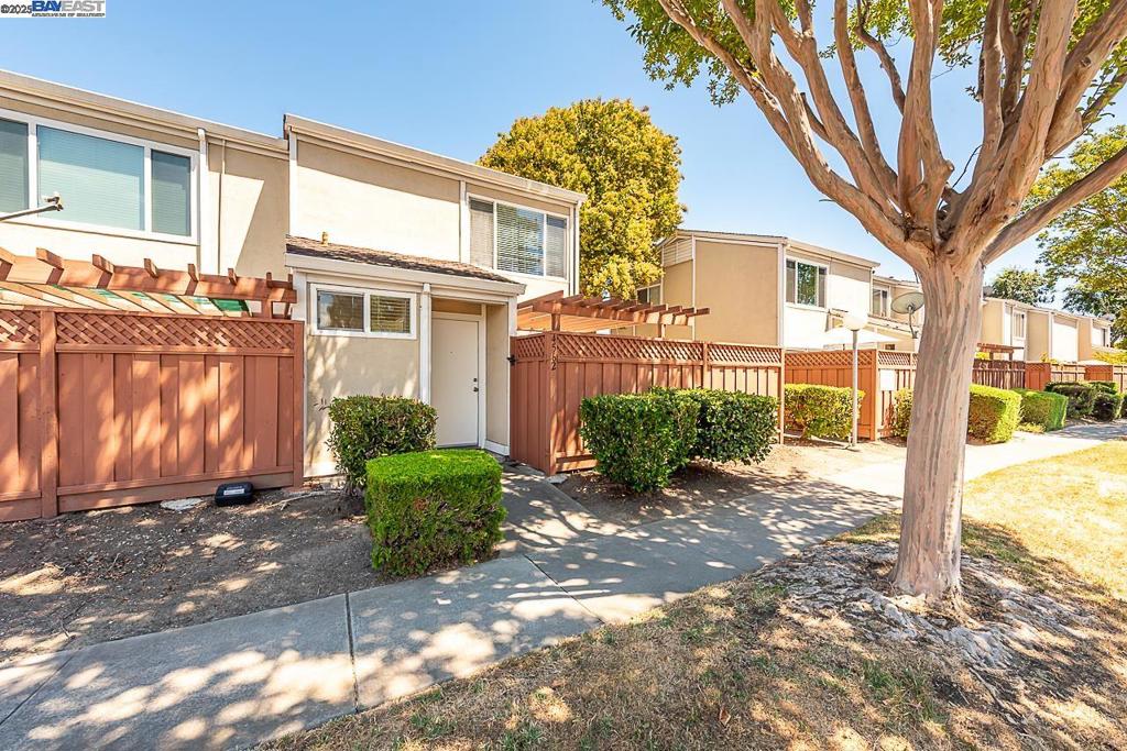 Welcome to this stunning townhome offering a bright and open floor plan with modern finishes throughout. Walk into a spacious living and dining room which includes a private patio off the living space - a low-maintenance outdoor area with a rich wooden pergola. A remodeled kitchen includes Shaker cabinets, stainless steel appliances and ample storage space. Conveniently offering an inside laundry area off the kitchen with washer/dryer. Two spacious bedrooms and newly remodeled bathrooms. Assigned parking located directly behind the home for easy backdoor entry. Additional upgrades include new laminate flooring throughout, new interior paint, recessed lights, newly remodeled bathrooms and more! A charming neighborhood conveniently located near top ranked Fremont schools and minutes from I-880/680, BART, Pacific Commons and major employers of the Bay Area.