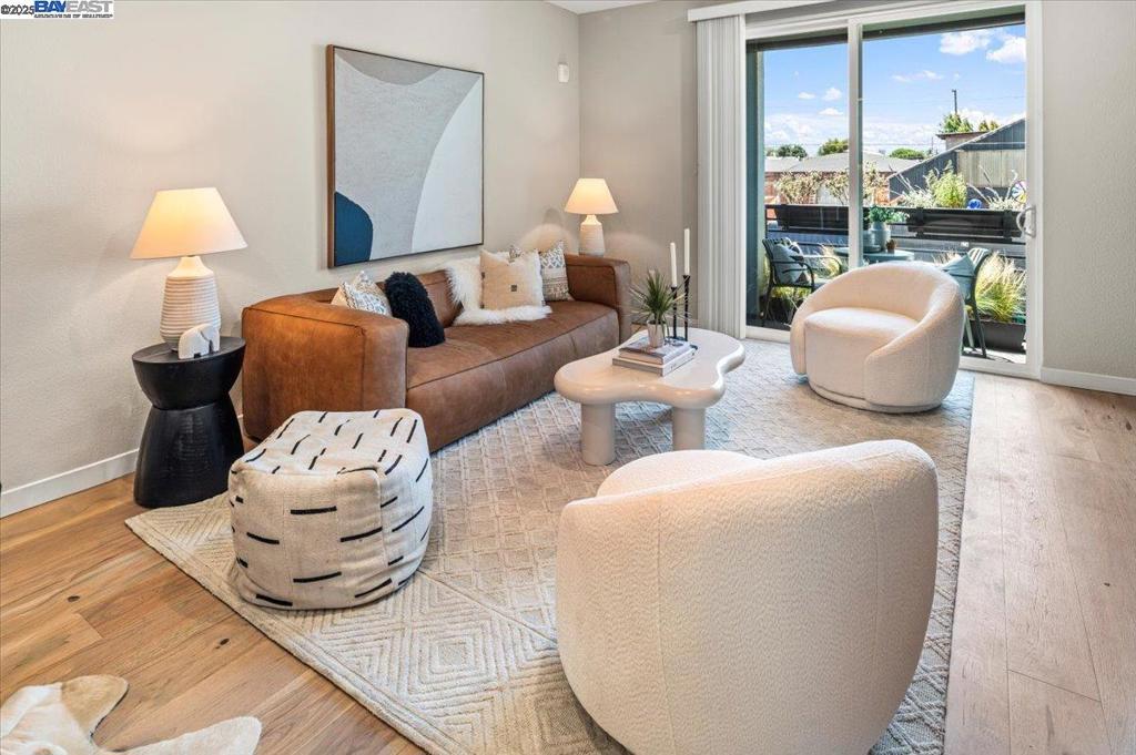 Built in 2022, this modern condo with owned solar and air conditioning is packed full of smart home features, and lives like a townhome, right in the heart of the up-and-coming Prescott neighborhood of West Oakland. The well-thought-out floorplan includes an open kitchen/living room with a balcony plus a bedroom/office and full bathroom on the primary level. Upstairs you’ll find two generous primary suites with ample closets and laundry. Secure, gated access to the inner sanctum offers security and peace of mind, while the central location delivers quick access to all the action of the city. This turn-key property, just a block from the Oakland Ballers’ field at Raimondi Park, serves as your home base in this vibrant Oakland Community with easy access to the West Oakland Farmers' Market, the new Prescott Market, plenty of stores and restaurants, as well as Pacific Pipe, the nation’s largest indoor climbing gym. The two-car tandem garage allows you to take advantage of seamless access to 580, 880, 80 and BART, getting you to anywhere in the Bay fast. With a walk score of 78 and bike score of 85, there’s so much to explore here.