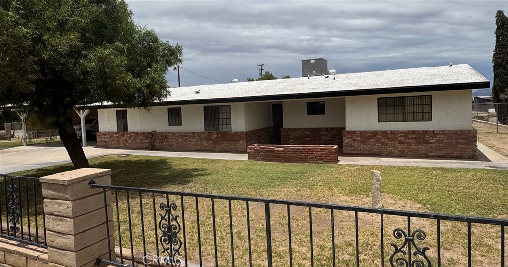 Recently remodeled 4 spacious bedrooms,2 and 3/4 bathroom Ranch style home on a ONE ACRE lot! Laminate flooring throughout.Two bedrooms have En-suite bathrooms!Recessed lights, ceiling fans in all bedrooms.Primary bedroom connects to a large En-suite bathroom shower, double sinks, and a big walk in closet.Kitchen features include Corian counters,electric cooktop, stove.recessed lighting and custom kitchen cabinets and pantry.All closet doors have been updated,Living room has plenty of space for any type of furniture.The Laundry room includes cabinetry or storage.The carport is large and has lighting.The backyard features a covered patio and plenty of space to park and store any type of vehicle.Public sewer services were added April 2024.New electric 40 gallon water heater installed.Roof has been serviced.The home is move-in ready.Schedule a showing to see this property today!