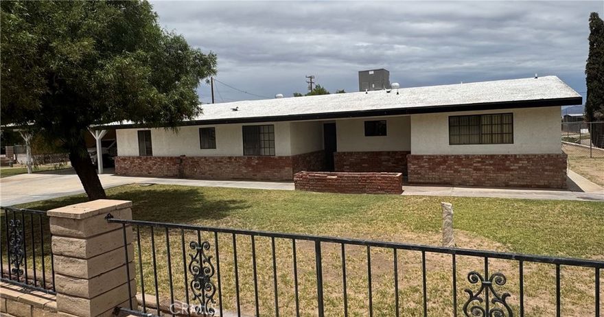 Recently remodeled 4 spacious bedrooms,2 and 3/4 bathroom Ranch style home on a ONE ACRE lot! Laminate flooring throughout.Two bedrooms have En-suite bathrooms!Recessed lights, ceiling fans in all bedrooms.Primary bedroom connects to a large En-suite bathroom shower, double sinks, and a big walk in closet.Kitchen features include Corian counters,electric cooktop, stove.recessed lighting and custom kitchen cabinets and pantry.All closet doors have been updated,Living room has plenty of space for any type of furniture.The Laundry room includes cabinetry or storage.The carport is large and has lighting.The backyard features a covered patio and plenty of space to park and store any type of vehicle.Public sewer services were added April 2024.New electric 40 gallon water heater installed.Roof has been serviced.The home is move-in ready.Schedule a showing to see this property today!