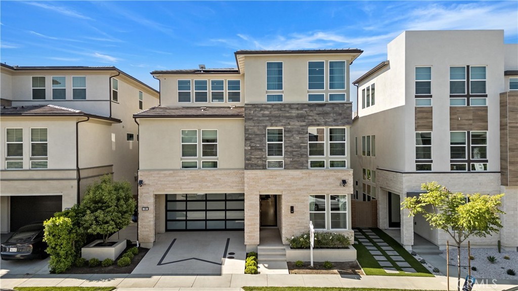 Modern Luxury Toll Brothers Home in Metro Heights, Montebello!Welcome to this exquisite three-story modern luxury residence in the prestigious, guard-gated community! This stunning home offers an exceptional blend of bold design, luxury finishes, and versatile spaces.
Enter through a dramatic three-story foyer highlighted by soaring ceilings and an elegant chandelier. To the right, a spacious room currently serves as a home office but can easily convert into a bedroom or private gym.The impressive two-story great room boasts custom wall paneling and a striking linear fireplace set against a floor-to-ceiling natural stone backdrop, creating a warm yet sophisticated atmosphere. Expansive sliding doors open to a beautifully landscaped backyard featuring a built-in children’s swing bed and tranquil water feature—perfect for entertaining or unwinding under the stars.The modern chef’s kitchen is a dream, offering a large center island with breakfast bar, abundant cabinetry and counter space, and a spacious walk-in pantry. A whole-house water filtration system further enhances comfort and peace of mind.
Upstairs, discover three ensuite bedrooms, including a luxurious primary suite with a private home theater setup complete with projector and screen. The primary suite also features a massive custom walk-in closet and a spa-inspired bathroom with a large soaking tub, lavish walk-in shower, dual vanities, and a Kohler smart toilet. Two secondary bedrooms each offer generous closets and premium Kohler fixtures.
The third floor opens to a versatile loft space with motorized window shades and a covered balcony—perfect for a media room, game room, or creative studio. An additional bedroom and full bathroom on this level provide excellent accommodation for guests.
Community highlights include a resort-style clubhouse, swimming pool and spa, fitness center, BBQ areas, and event spaces, all within the secure gated environment of Metro Heights.Ideally located close to Downtown Los Angeles with easy access to the 60 Freeway, this home offers quick commutes and a vibrant lifestyle, with shopping, dining, and entertainment just minutes away.Experience luxury, comfort, and modern elegance in this exceptional home!