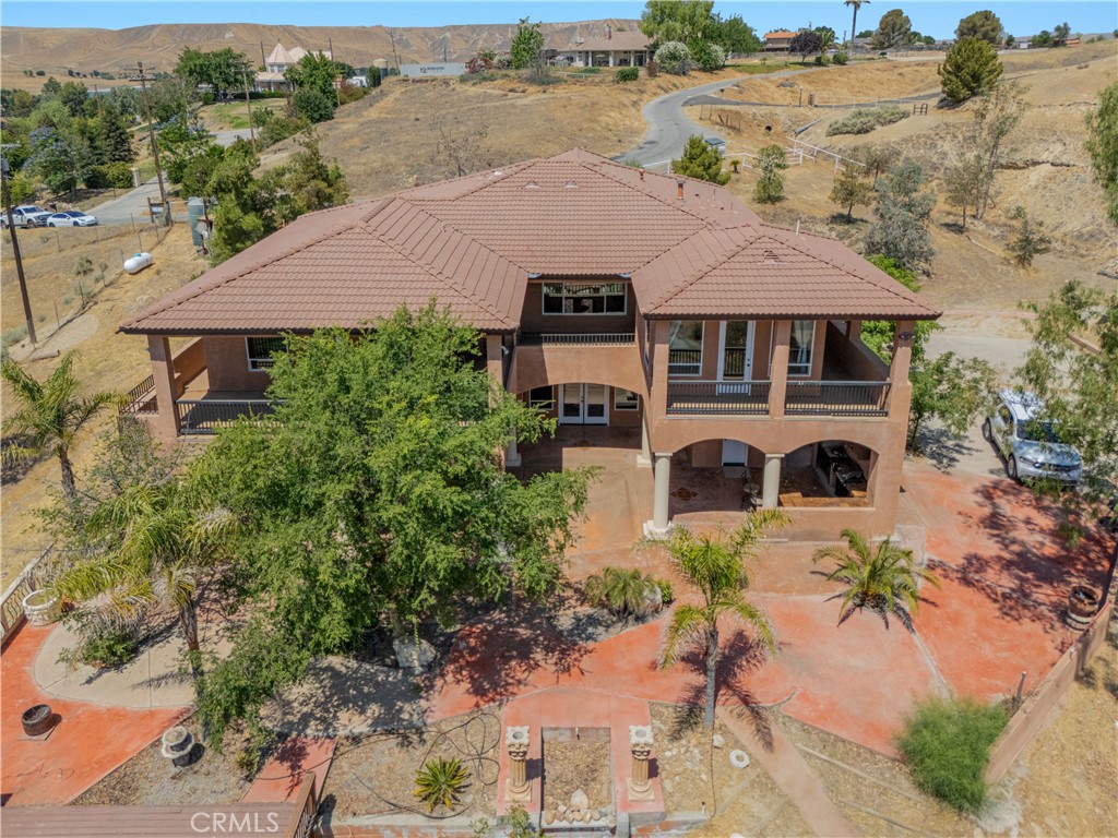 Custom Home with Panoramic Views in Choctaw Valley Experience luxury and privacy in this beautifully crafted 5-bed, 4-bath home with a media room on 2.97 acres. Enjoy stunning views of Lake Ming and the foothills from wraparound balconies. The spacious floorplan features a grand entry, formal living and dining areas, a chef's kitchen with double ovens and walk-in pantry, and upstairs laundry for added convenience. The owner's suite includes dual closets and breathtaking views. The media room can easily be used as a junior suite. Outside, entertain with a covered patio and outdoor kitchen, plus plenty of room for horses or expansion. Extras include a private well, well house, and oversized 3-car garage.