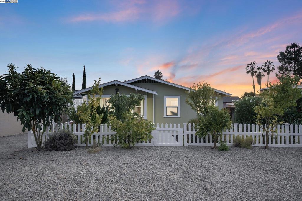 Experience the perfect blend of timeless character and modern convenience in this beautifully maintained 3BR/2BA residence, ideally located in the heart of Mission San Jose—just steps from Mission Elementary and top-ranked schools. Set on a generous 7,500 sq ft R2 lot, this historic home features an updated kitchen, recessed lighting, and an electric car charger for today’s lifestyle. A fully enclosed barn offers a 2-car tandem garage and a 400 sq ft finished bonus room—perfect as a studio, home office, or potential ADU. The private backyard is a serene retreat, showcasing a lush vineyard beneath a charming pergola, along with mature fruit trees including persimmon, apple, peach, avocado, pomegranate, lime, and orange. With its unique combination of charm, functionality, and rare potential to build two homes, this property presents an exceptional opportunity in one of Fremont’s most sought-after neighborhoods.