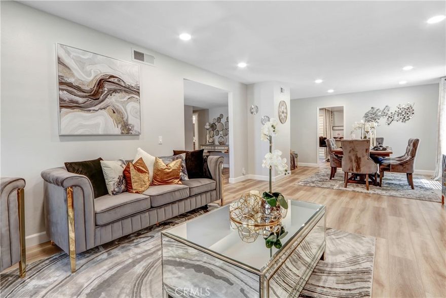 Perfect for Families! This 4 bed / 3 bath home (with a full bed + bath downstairs) of comfortable living space. Bright rooms, hardwood floors, and a quiet neighborhood make it easy to call home.  Enjoy close proximity to parks, greenbelts, tennis courts, award-winning schools, Bella Terra, Mile Square Park, Huntington Beach, South Coast Plaza, major freeways, and John Wayne Airport. Don’t miss this move-in ready gem in a prime location! Everything your family needs is right here!