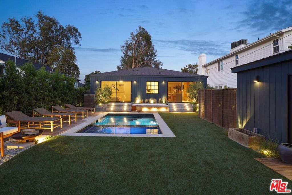 A Bespoke Retreat in Sherman Oaks. Welcome to this impeccably renovated single-story masterpiece in the heart of Studio City, just moments from the newly revitalized Sportsmen's Lodge and some of L.A.'s finest dining, shopping, and entertainment. Situated on a flat, tree-lined street with sidewalks and curated landscaping, this 4-bedroom, 3.5-bathroom home exemplifies modern elegance and sustainable living at its finest.Step inside to a sun-drenched, open-concept floor plan thoughtfully designed with premium, eco-conscious materials and sophisticated finishes. From the moment you enter, you're greeted by custom Emtek door handles, EMTouch keypad entry, and German-engineered locks that blend luxury with state-of-the-art security.The interiors showcase white oak wood paneling, custom interior doors, and Italian VOC-free, gold-certified wood flooring, sustainably sourced and designed for both beauty and wellness. All plywood is ethically sourced through a fully transparent supply chain and certified by SFI, PEFC, and FSC ensuring zero VOCs and no off-gassing for a cleaner, healthier indoor environment. Some walls are finished in Portola plaster and all with no-VOC paint, offering texture and tranquility throughout.In the kitchen, bespoke craftsmanship meets cutting-edge performance. Thermador appliances are paired with Kast sinks handmade in the UK using locally sourced stone and natural pigments and elegant Waterworks faucets. The space is illuminated by Allied Maker, Paul Matter, and Volker Haug lighting. Framed by energy-efficient Fleetwood and Marvin doors, allowing seamless indoor-outdoor living.The spa-inspired primary suite is a sanctuary of calm, complete with a wet room shower, a freestanding soaking tub, and luxurious Phylrich fixtures. Bathrooms throughout the home are dressed in eco-friendly, lead-free stone and tile, emphasizing both style and sustainability.Outdoors, the resort-style backyard features a new saltwater pool and jacuzzi powered by high-efficiency systems. A custom wood garage door and securely gated front yard offer privacy, curb appeal, and peace of mind.This home is built with health, safety, and sustainability at its core. The insulation is Greenguard Gold certified, formaldehyde-free, made from recycled content, and energy efficient. All windows and doors are fire-resistant, secure, and designed for exceptional thermal performance. Exterior materials are fire-resistant, environmentally conscious, and built to last.Every detail has been curated for those who seek the intersection of modern design, wellness, and responsible luxury. Don't miss the opportunity to own one of Studio City's most thoughtfully executed residences.