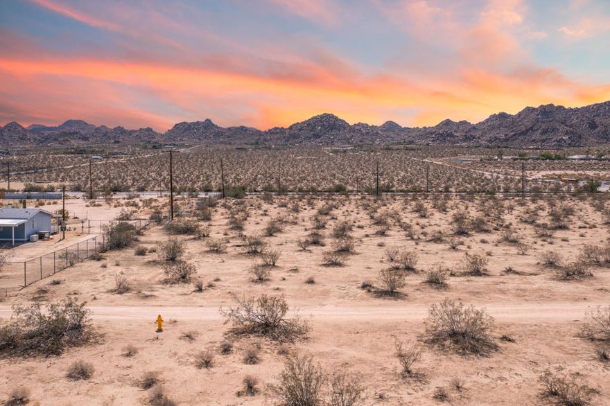 Calling all builders, investors, and visionaries! This 2.29-acre parcel sits right on Twentynine Palms Highway, offering unbeatable visibility, accessibility, and development potential in the heart of Joshua Tree. Zoned JT/RM (Joshua Tree/Multiple Residential), this property opens the door to a wide range of possibilities -- from multiple residential dwellings, licensed/unlicensed residential care, and child care facilities, to special event venues, produce stands, libraries, museums, art galleries, outdoor exhibits, meeting facilities, agricultural uses, and more (buyer to verify). With its generous size, prime location, and diverse zoning, this lot is perfectly positioned to generate a strong ROI. Opportunities like this -- combining highway frontage, flexible use, and affordable pricing -- don't come around often. Act quickly... this one won't last long!