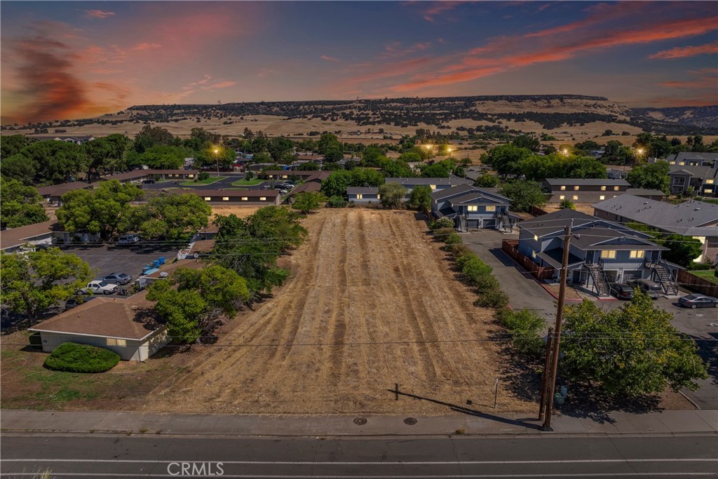 Prime Development Opportunity - Unlock the potential of this ideally located vacant lot in the heart of Oroville!
Situated on Nelson Avenue, a well-traveled thoroughfare with easy access to downtown, shopping centers, schools, and Highway 70, this spacious and level parcel offers an outstanding opportunity for investors, builders, or business owners.
Whether you're looking to develop residential, commercial, or mixed-use, this lot delivers flexibility and visibility in a fast-growing area of Butte County. Utilities are nearby, and zoning supports a variety of uses - buyers are encouraged to verify with the City of Oroville for specific development possibilities.
PROPERTY OVERVIEW
• Address: 82 Nelson Avenue, Oroville, CA 95965
• Lot Size: 0.58
• Zoning: R2m
• Flat, usable land with excellent street frontage
• Close proximity to schools, parks, and public transportation
• Less than 5 minutes to downtown Oroville and Highway 70
DEVELOPMENT POTENTIAL
• Suggested development of 12 units at 400 sq/ft each (see conceptual layout)
• Gross income potential of $172,080/yr ($14,340/mo)
• Estimated buildout cost of $1,800,000 (based on $150,000 per unit build cost estimate)
• Potential for additional, multilevel unit development at buyer’s discretion
Don't miss your chance to invest in this versatile property with significant upside potential. Bring your vision to life in this well-positioned, high-visibility location!