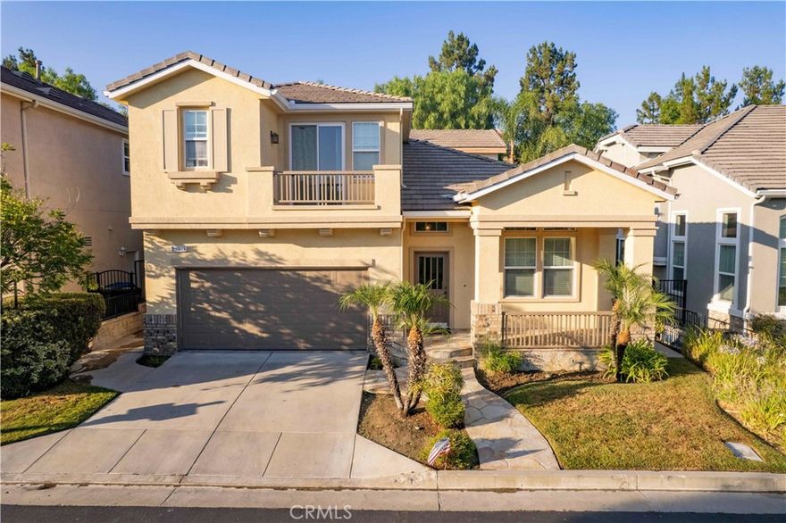 Price reduced by $300 per month – move -in ready. 

Discover this beautifully updated 4-bedroom, 3-bathroom detached home in the prestigious Promenade Guard-Gated Community of Porter Ranch. Offering nearly 2,400 sq. ft. of bright open living space. Step inside to a freshly painted interior with new Austin Oak plank flooring throughout. The inviting floor plan features a spacious living room with high ceiling, a cozy family room with fireplace, and a modern kitchen complete with a brand-new stainless-steel refrigerator, over-the range microwave, center island, and white tile countertops. Upstairs, enjoy a large master suite with a walk-in closet, private balcony, and updated bathroom light fixtures, plus two additional bedrooms and a laundry area. A fourth bedroom and full bath are conveniently downstairs—perfect for guests or a home office. Additional highlights include an attached 2-car garage, recessed lighting, crown molding, and access to community amenities such as a 24-hour guarded gate, pool, spa, BBQ, and green spaces. Ideally located near Porter Ranch Town Center, shopping, restaurants, movie, the YMCA, and the Valley Country Club. Zoned for to-rated schools, including Sierra Canyon.