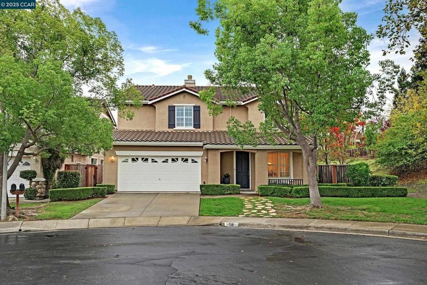 Located in one of Danville’s most sought-after neighborhoods, California Meadows, this beautiful home sits at the end of a serene court on a spacious lot offering privacy and extra land on the side. With 5 bedrooms, 2.5 bathrooms, and an oversized loft, the 2,623 square feet of living space feels open and inviting. The welcoming front porch and striking curb appeal set the tone for the stunning interior featuring soaring ceilings and abundant natural light. The expansive formal living and dining rooms flow seamlessly into the gorgeous kitchen with granite counters, 4-burner gas range, oversized island, eat-in nook, and ample cabinetry, all overlooking the cozy family room with gas fireplace. A dedicated office/den is conveniently located off the family room. Upstairs, the large loft is ideal for a game room or media retreat, while the impressive primary suite boasts a spa-like bath with dual vanities, jacuzzi tub, separate shower, and an oversized walk-in closet. The backyard is a true oasis with a lush lawn, mature trees, and an expansive patio with retractable awning perfect for entertaining. Additional highlights include recessed lighting, plantation shutters, brand new flooring, fresh interior paint, and baseboards throughout. This home is perfection and is move-in ready!