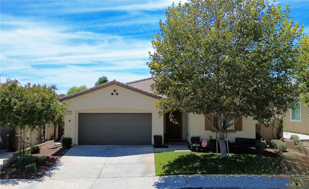 This stunning 4-bedroom, 2-bath residence in the coveted Rosena Ranch community offers the perfect blend of style and convenience. The open floor plan is a dream for entertaining, with the light-filled kitchen flowing seamlessly into the main living areas, so you're always connected. A spacious living room with a cozy fireplace and a modern kitchen with a large island create the perfect gathering space. The private primary suite is a true retreat, complete with a luxurious soaking tub and separate shower.
Beyond the beautiful interior, you'll find a wide, welcoming hallway that leads to the bedrooms, creating a sense of spaciousness and privacy. Smart upgrades like solar panels for energy savings and a low-maintenance backyard with a gated dog run and turf add to the appeal. The converted garage is a versatile bonus space, perfect for a lively game room or a comfortable family room.
Living here means enjoying resort-style amenities, including two sparkling pools, a clubhouse, and a fitness center. With top-rated Paakuma K-8 School within walking distance and easy access to shopping and dining at Victoria Gardens, this home truly has it all.